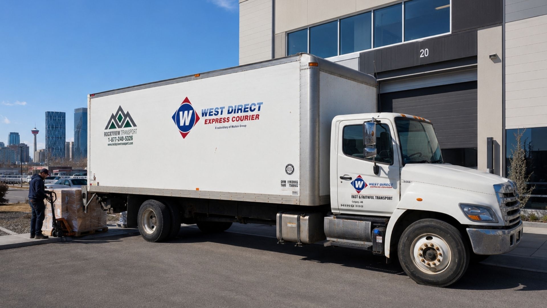 West Direct Express Courier truck loading packages for rush delivery in Calgary, with the downtown skyline in the background.