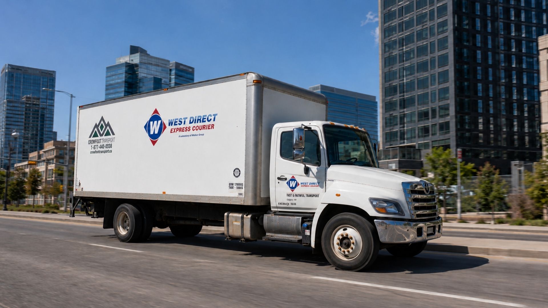 West Direct box truck on a city product distribution route.